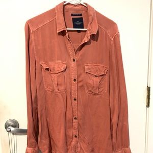 salmon colored long sleeve collared shirt